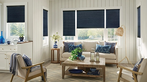 Navy cellular shades in a large white living room