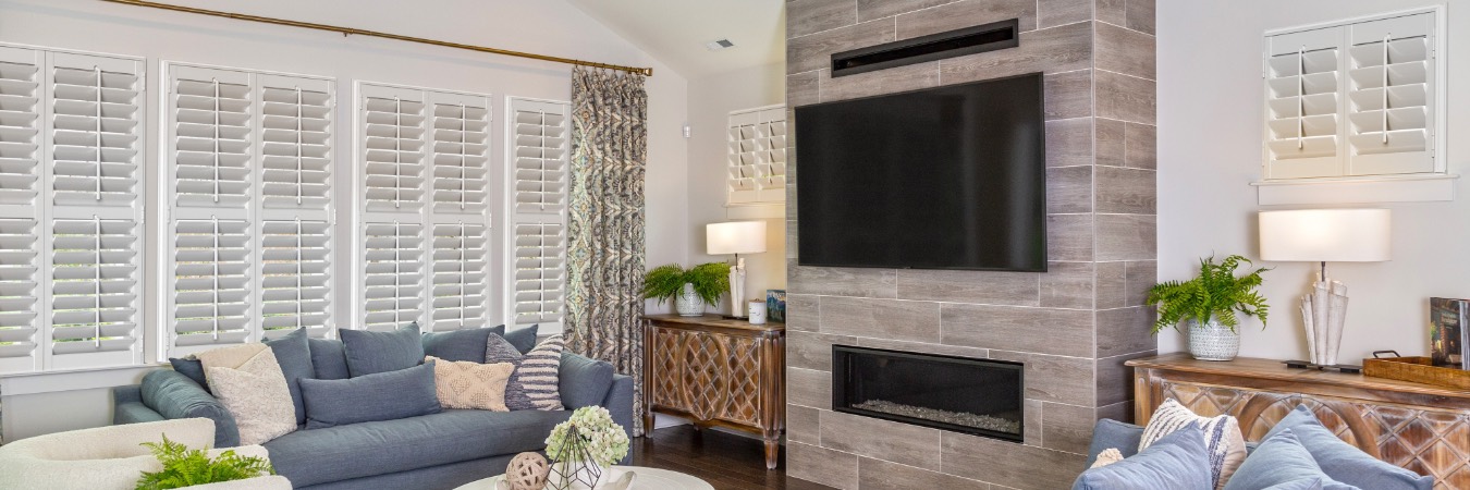 Plantation shutters in Menifee living room with fireplace