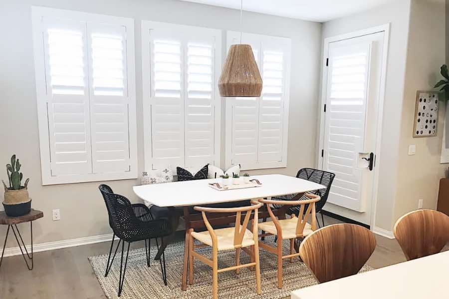 Use Polywood shutters to control natural light levels in your Riverside dining room. Polywood shutters with top louvers tilted open in a dining room