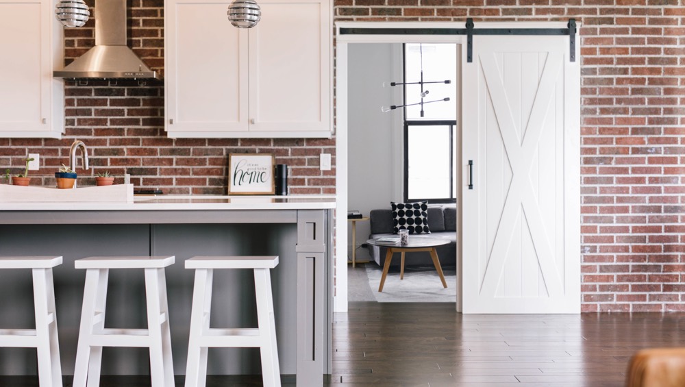 Sunburst is Riverside's Home for Stylish Barn Doors Riverside brick wall barn door