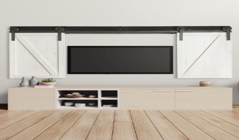 Barn-door shutters framing a flat-screen TV in Riverside.