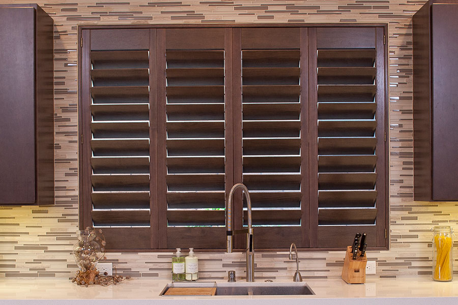 Choose Ovation shutters to liven up your picture windows. Ovation shutters above a modern kitchen sink
