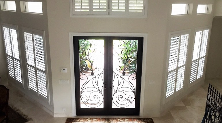 White shutters work in Riverside entryways Riverside foyer plantation shutters