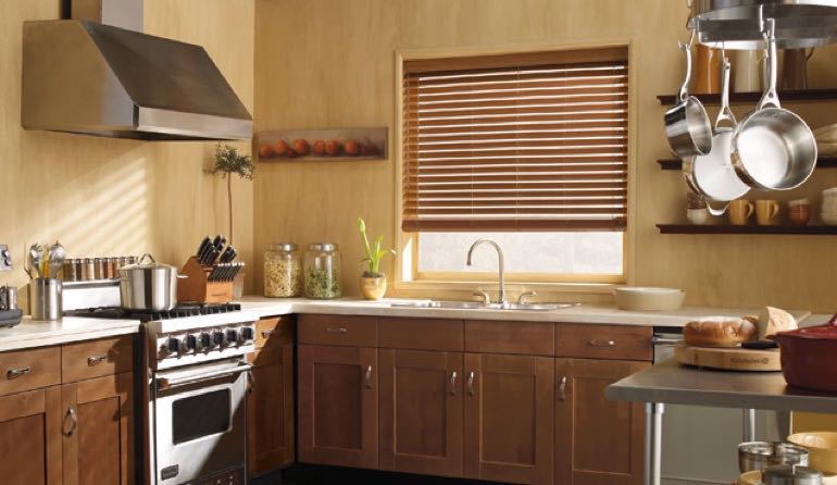 Faux wood blinds look gorgeous in Riverside kitchens. Riverside kitchen faux wood blinds.