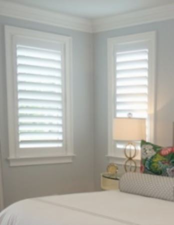 Hidden tilt rod shutters open. White plantation shutters with hidden tilt rods in Riverside
