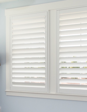 Hidden tilt rod shutters closed. White plantation shutters with hidden tilt rods in Riverside