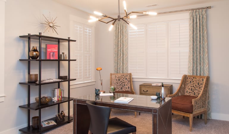 Riverside home office with plantation shutters.