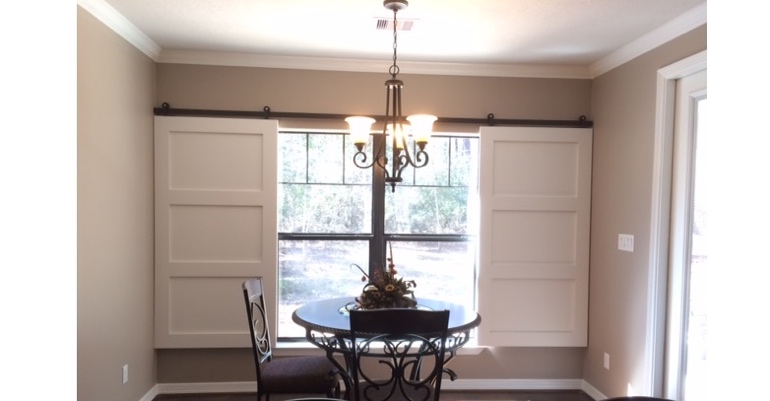 Barn doors open horizontally with slides instead of cords. Riverside barn door shutters