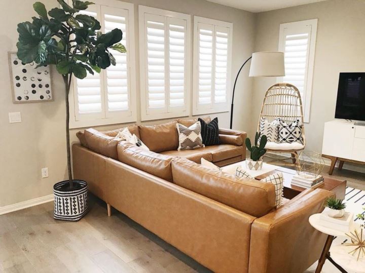 Warm living room with our Polywood shutters in Riverside.