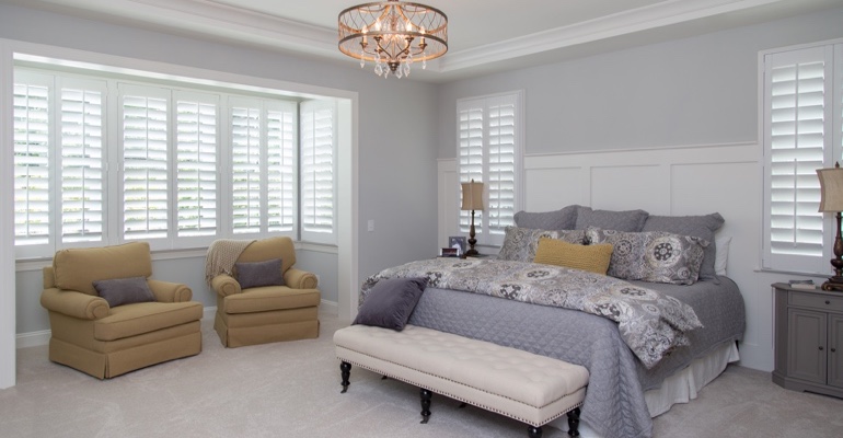 interior shutters offer subtle fashion. Interior shutters in Riverside bedroom.
