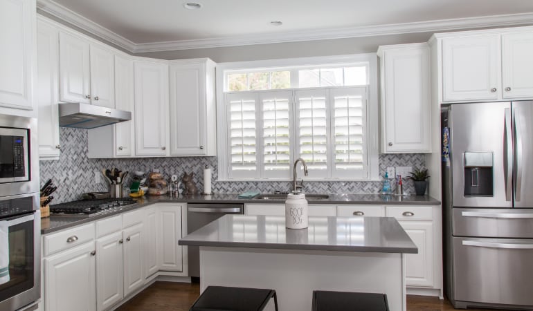 Polywood® plantation shutters resist heat and moisture in your kitchen. Polywood shutters in a Riverside gourmet kitchen.