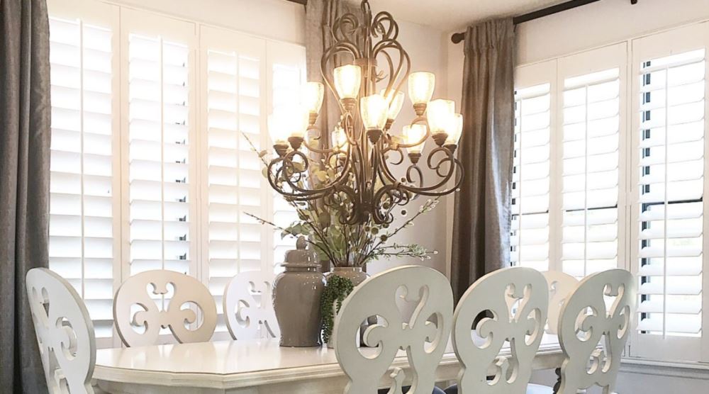 Polywood® shutters are a smart alternative when you want cordless window treatments. dining room with white interior shutters