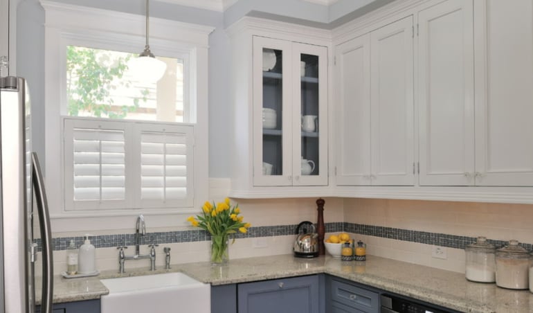 It's easy to clean kitchen messes off of your Polywood® plantation shutters.  Polywood shutters in a Riverside kitchen.
