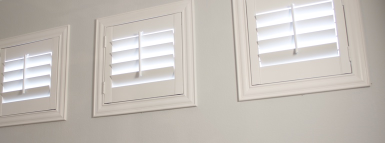 Square Windows in a Riverside Garage with Polywood Shutters