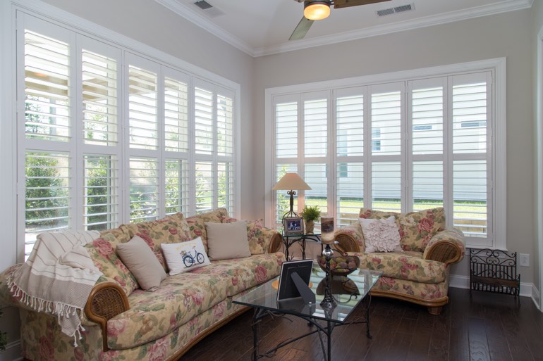Traditional sunroom with faux wood shutters in Riverside.