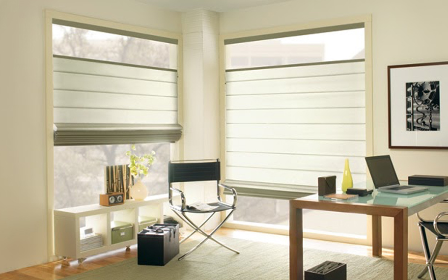Upgrade your windows with stylish window shades or shutters in Riverside. Stylish sheer shades in the corner of a modern office.