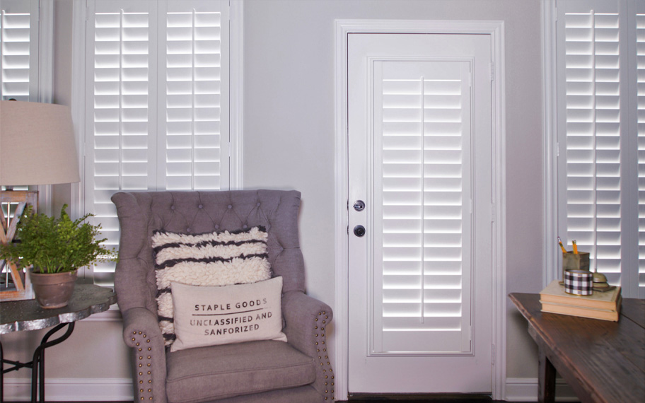 Interior shutters are beautiful and durable window treatments for glass doors in Riverside. Polywood shutters on a door