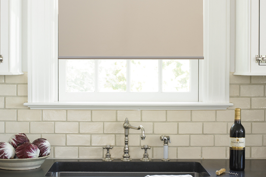 Roller shades opens up a lot of color and style options for your gourmet kitchen at Riverside. Roller shade above a kitchen sink.