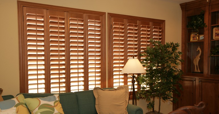Natural wood shutters in Riverside living room.