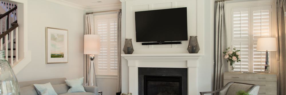 White Polywood shutters on windows in a living room